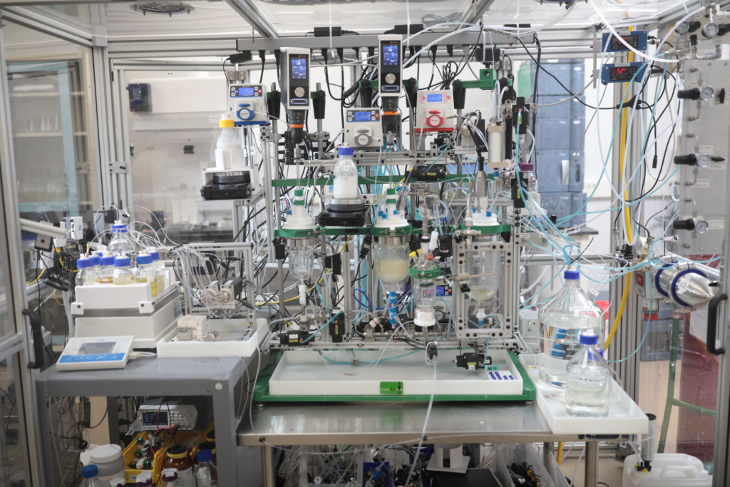 Supporting the Development of Scalable Manufacturing Processes for Complex Synthetics through Automation and Machine Learning